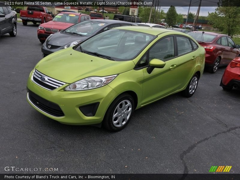 Lime Squeeze Metallic / Light Stone/Charcoal Black Cloth 2011 Ford Fiesta SE Sedan