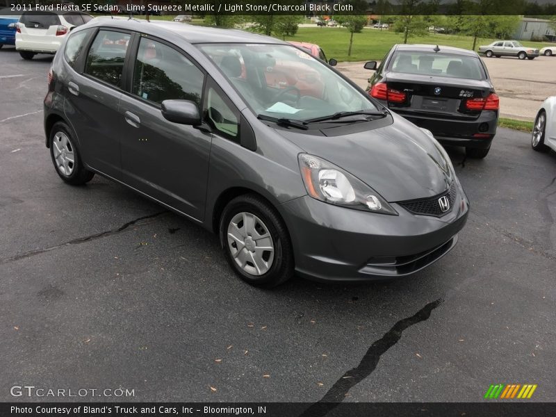 Lime Squeeze Metallic / Light Stone/Charcoal Black Cloth 2011 Ford Fiesta SE Sedan