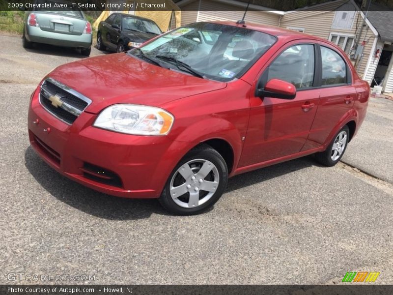 Victory Red / Charcoal 2009 Chevrolet Aveo LT Sedan