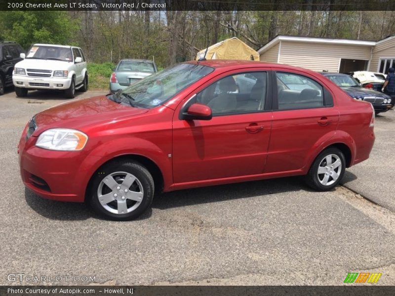 Victory Red / Charcoal 2009 Chevrolet Aveo LT Sedan
