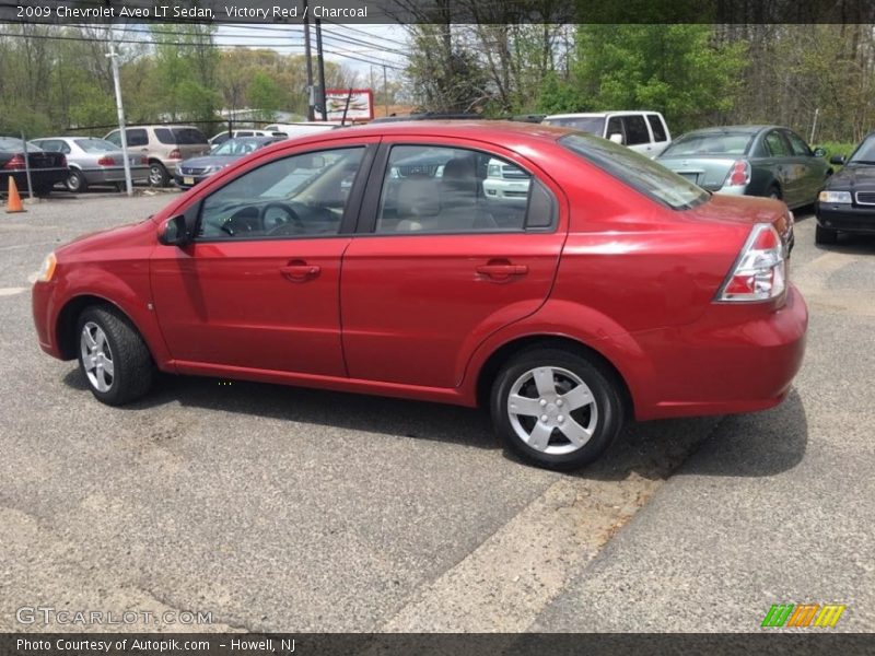 Victory Red / Charcoal 2009 Chevrolet Aveo LT Sedan