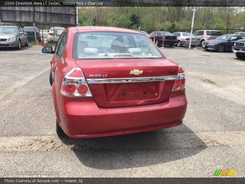 Victory Red / Charcoal 2009 Chevrolet Aveo LT Sedan
