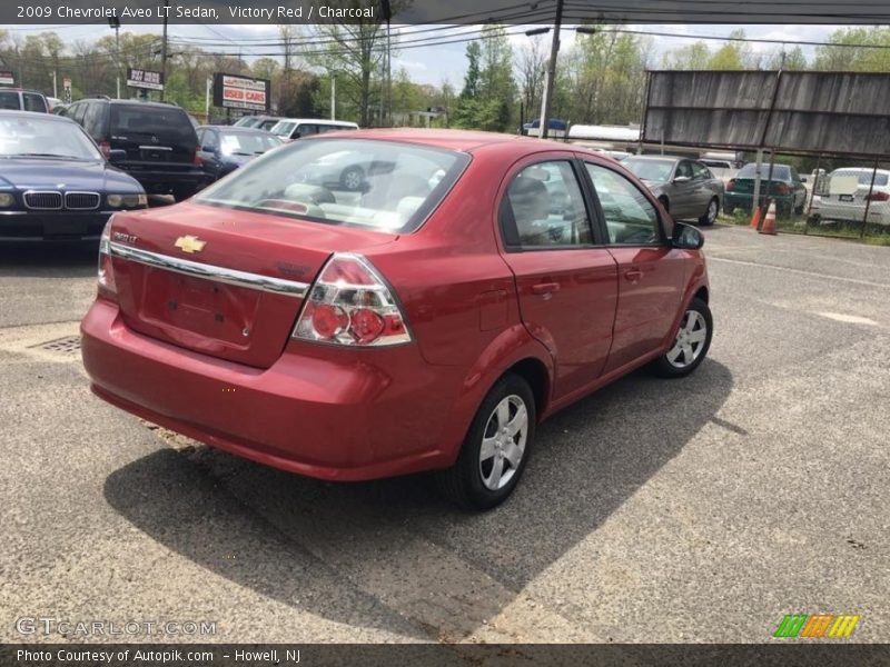 Victory Red / Charcoal 2009 Chevrolet Aveo LT Sedan