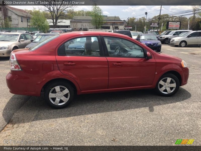 Victory Red / Charcoal 2009 Chevrolet Aveo LT Sedan