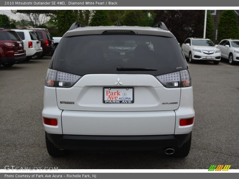 Diamond White Pearl / Black 2010 Mitsubishi Outlander SE 4WD