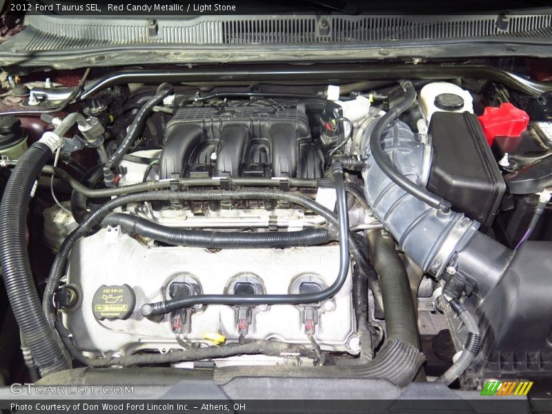 Red Candy Metallic / Light Stone 2012 Ford Taurus SEL