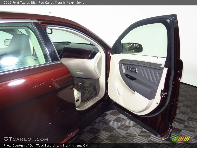 Red Candy Metallic / Light Stone 2012 Ford Taurus SEL