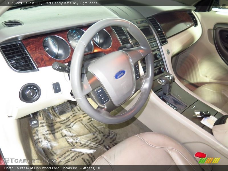 Red Candy Metallic / Light Stone 2012 Ford Taurus SEL