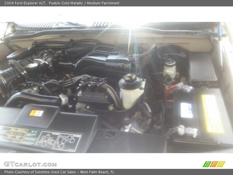 Pueblo Gold Metallic / Medium Parchment 2004 Ford Explorer XLT