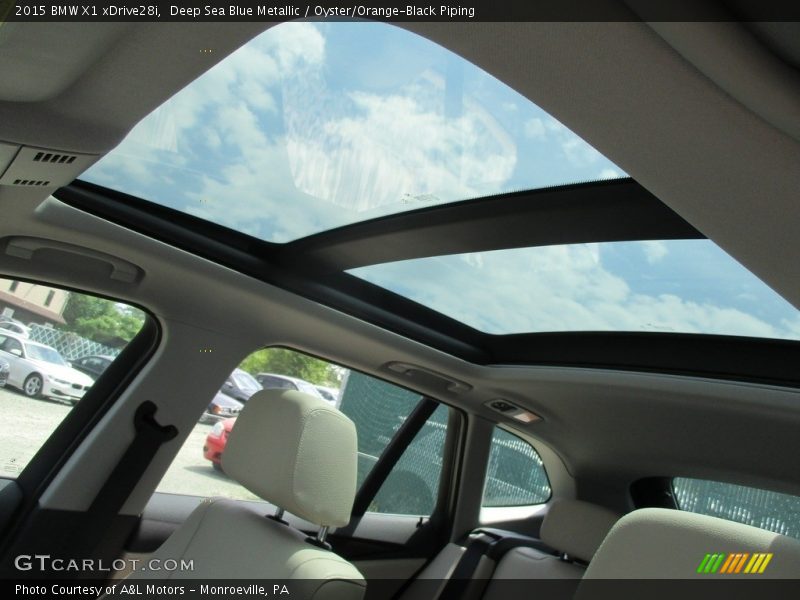 Deep Sea Blue Metallic / Oyster/Orange-Black Piping 2015 BMW X1 xDrive28i