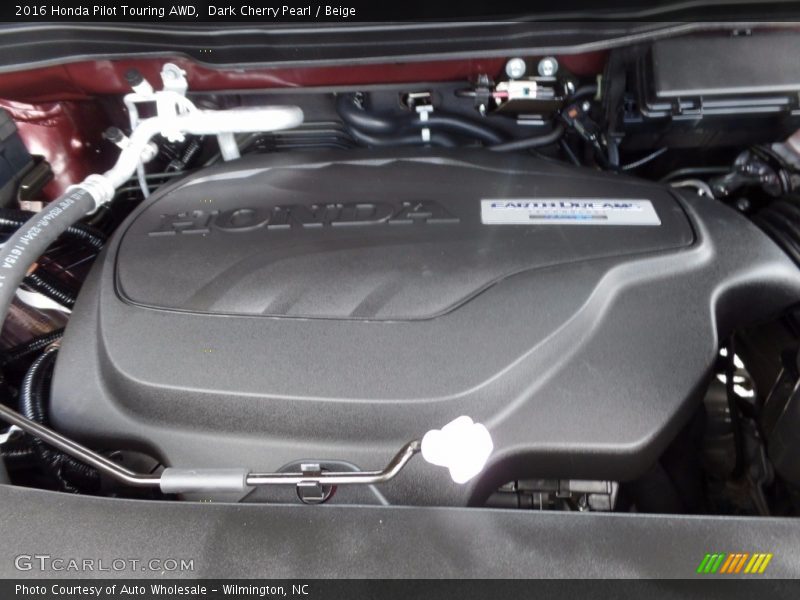 Dark Cherry Pearl / Beige 2016 Honda Pilot Touring AWD
