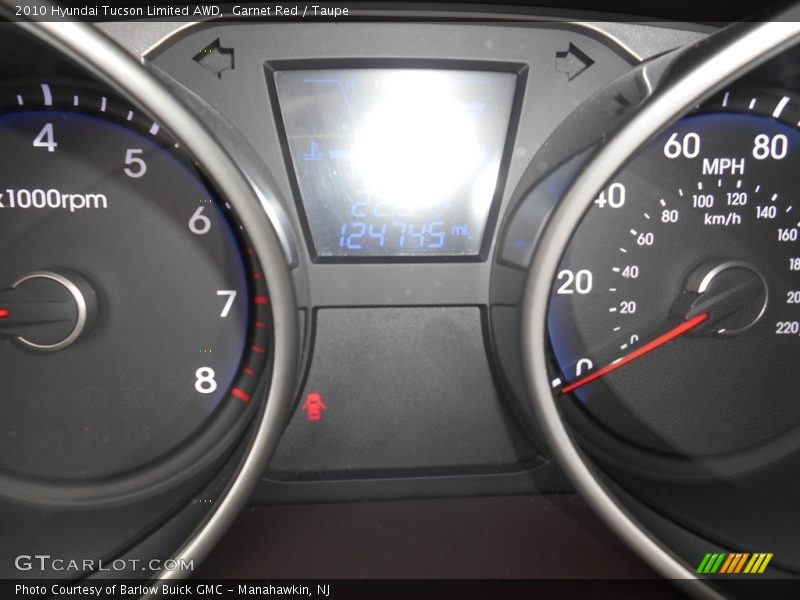 Garnet Red / Taupe 2010 Hyundai Tucson Limited AWD