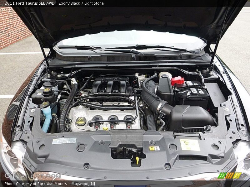 Ebony Black / Light Stone 2011 Ford Taurus SEL AWD