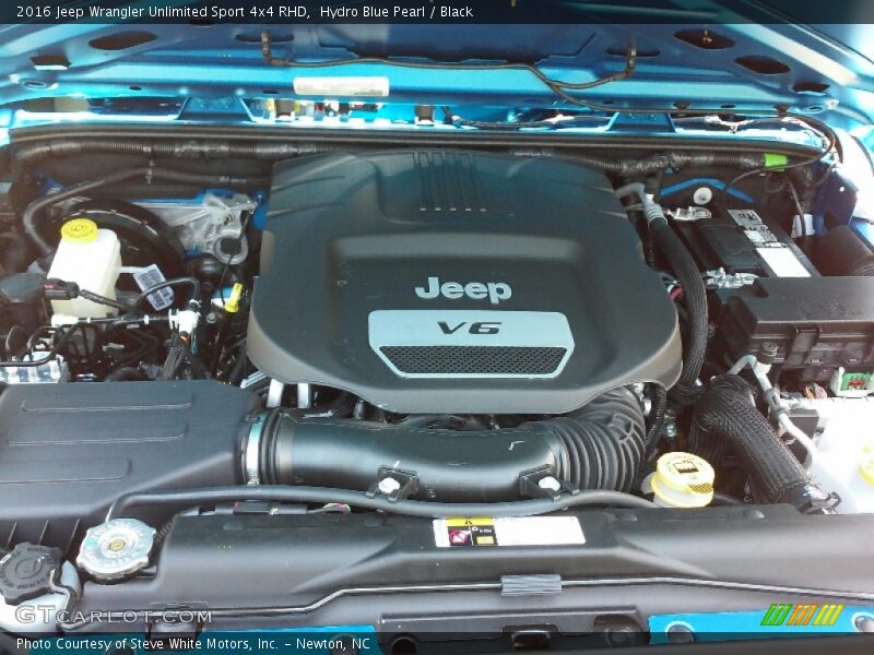 Hydro Blue Pearl / Black 2016 Jeep Wrangler Unlimited Sport 4x4 RHD