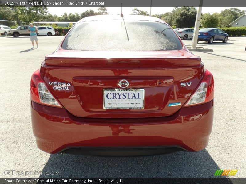 Red Brick / Charcoal 2015 Nissan Versa 1.6 SV Sedan