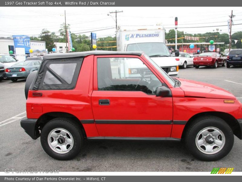 Wildfire Red / Dark Charcoal 1997 Geo Tracker Soft Top 4x4