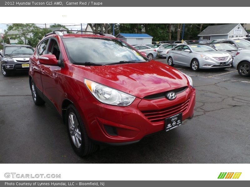 Garnet Red / Taupe 2012 Hyundai Tucson GLS AWD