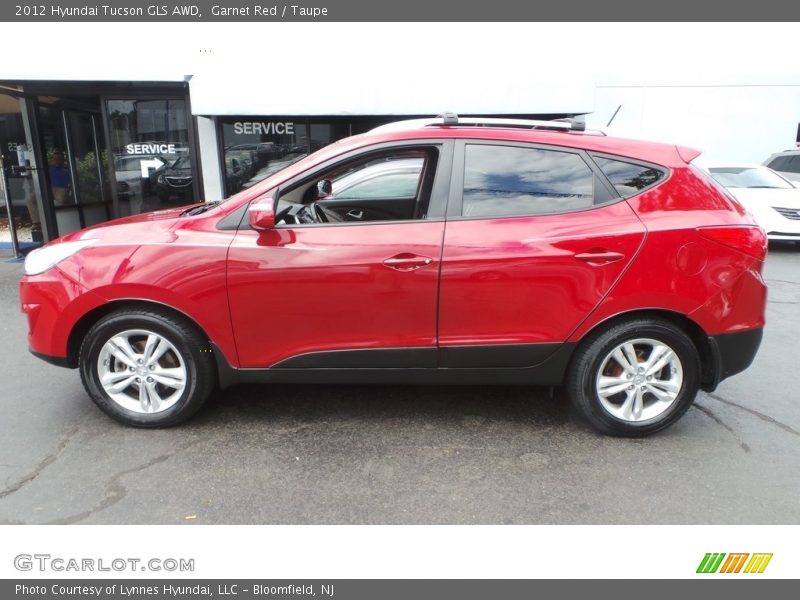 Garnet Red / Taupe 2012 Hyundai Tucson GLS AWD