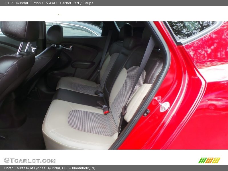 Garnet Red / Taupe 2012 Hyundai Tucson GLS AWD