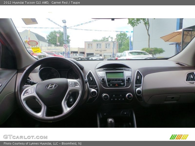 Garnet Red / Taupe 2012 Hyundai Tucson GLS AWD