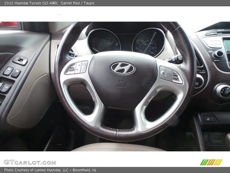 Garnet Red / Taupe 2012 Hyundai Tucson GLS AWD