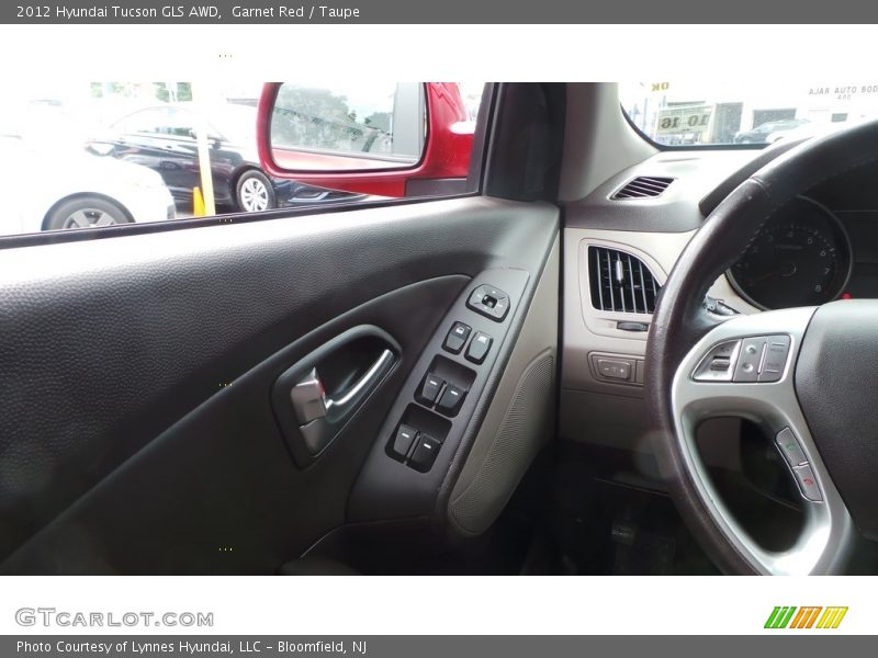Garnet Red / Taupe 2012 Hyundai Tucson GLS AWD