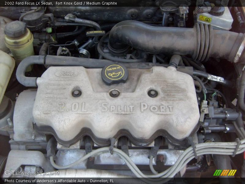 Fort Knox Gold / Medium Graphite 2002 Ford Focus LX Sedan