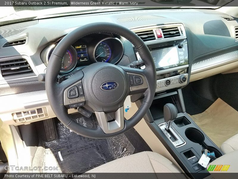 Wilderness Green Metallic / Warm Ivory 2017 Subaru Outback 2.5i Premium