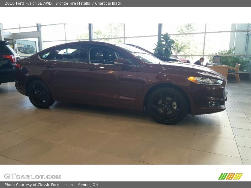 Bronze Fire Metallic / Charcoal Black 2016 Ford Fusion SE AWD