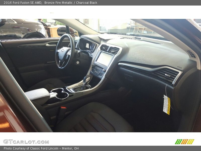 Bronze Fire Metallic / Charcoal Black 2016 Ford Fusion SE AWD