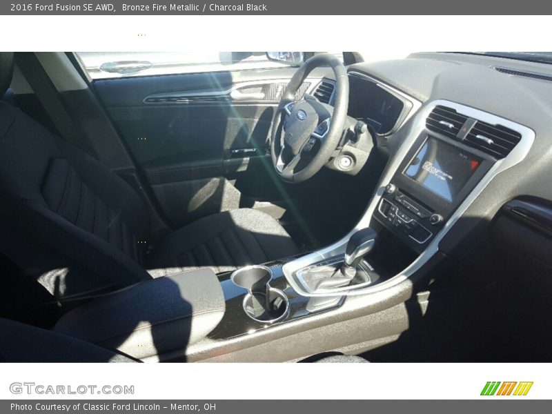 Bronze Fire Metallic / Charcoal Black 2016 Ford Fusion SE AWD