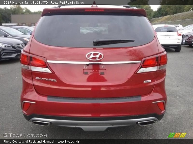 Regal Red Pearl / Beige 2017 Hyundai Santa Fe SE AWD