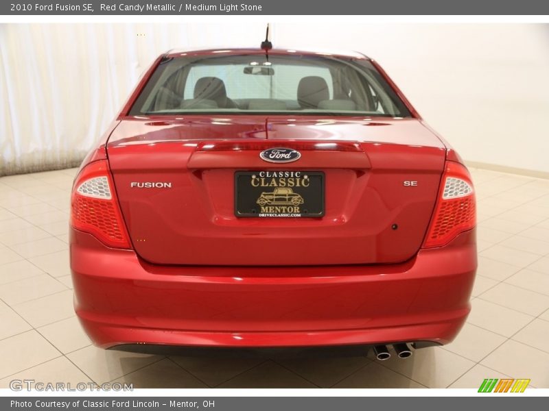 Red Candy Metallic / Medium Light Stone 2010 Ford Fusion SE