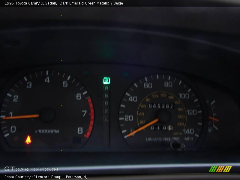 Dark Emerald Green Metallic / Beige 1995 Toyota Camry LE Sedan