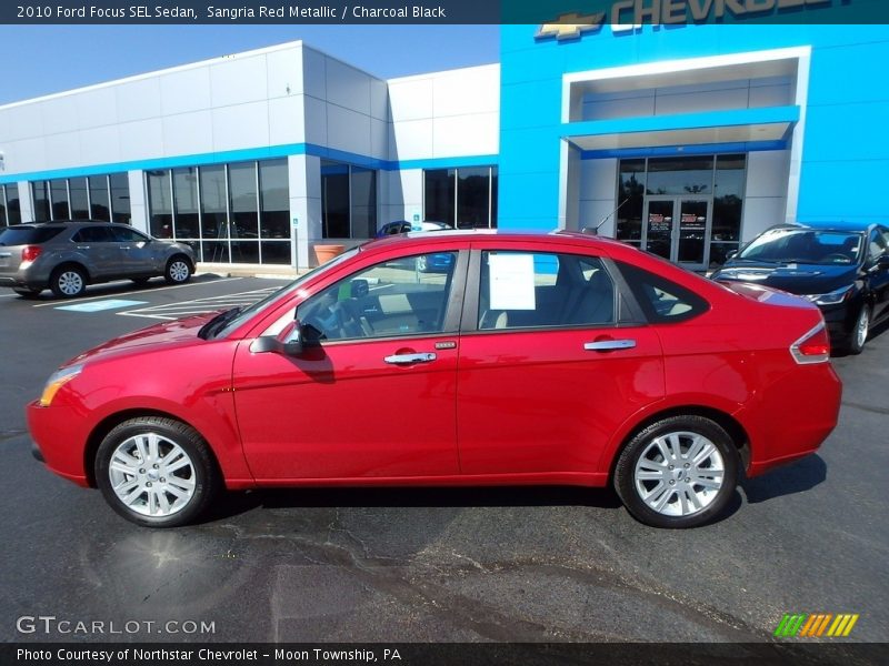 Sangria Red Metallic / Charcoal Black 2010 Ford Focus SEL Sedan