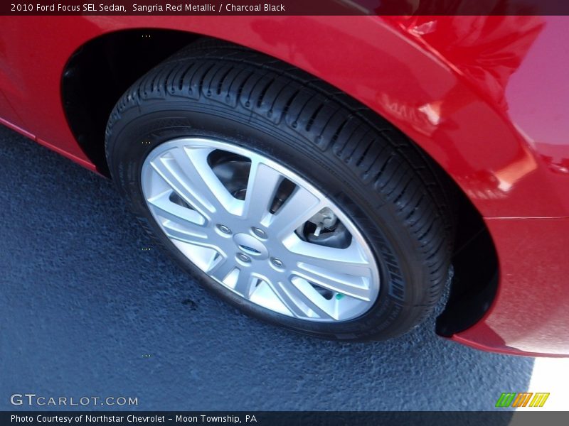 Sangria Red Metallic / Charcoal Black 2010 Ford Focus SEL Sedan