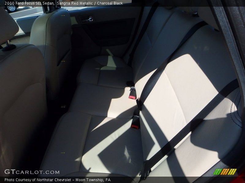 Sangria Red Metallic / Charcoal Black 2010 Ford Focus SEL Sedan