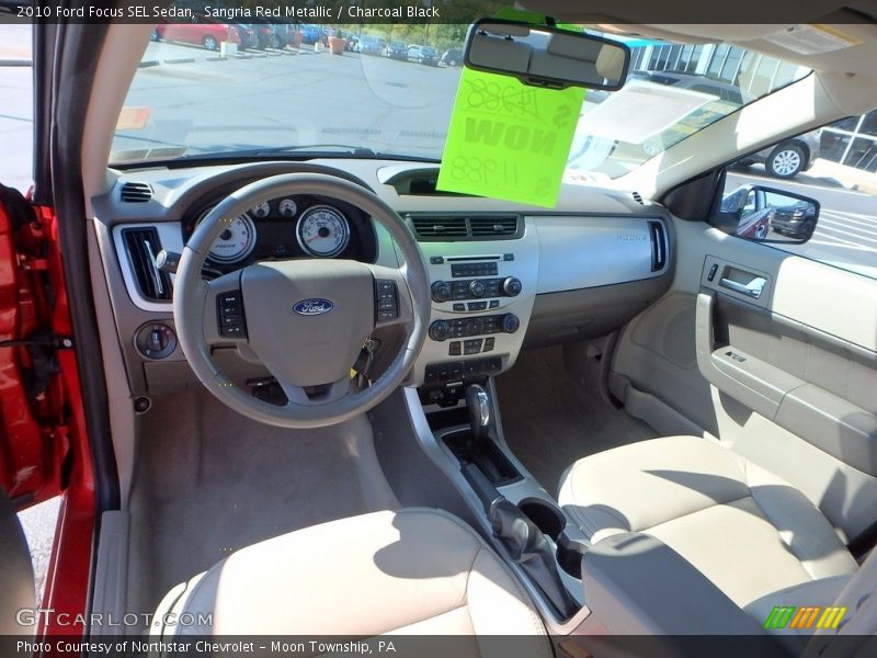 Sangria Red Metallic / Charcoal Black 2010 Ford Focus SEL Sedan