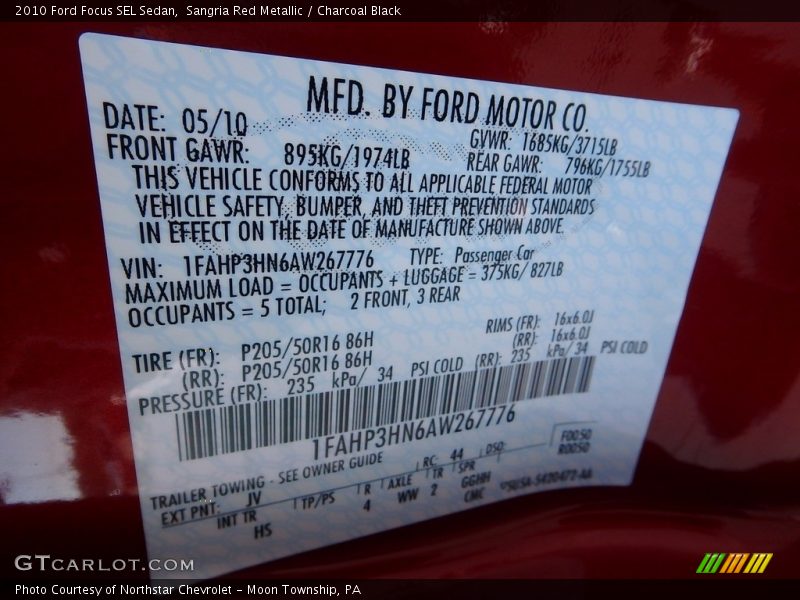 Sangria Red Metallic / Charcoal Black 2010 Ford Focus SEL Sedan