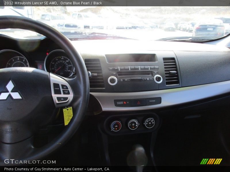 Octane Blue Pearl / Black 2012 Mitsubishi Lancer SE AWD