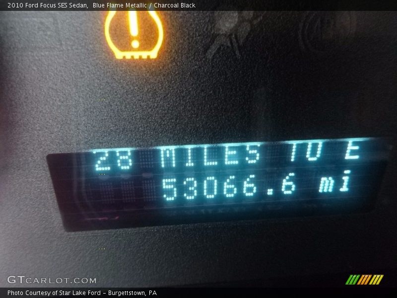 Blue Flame Metallic / Charcoal Black 2010 Ford Focus SES Sedan