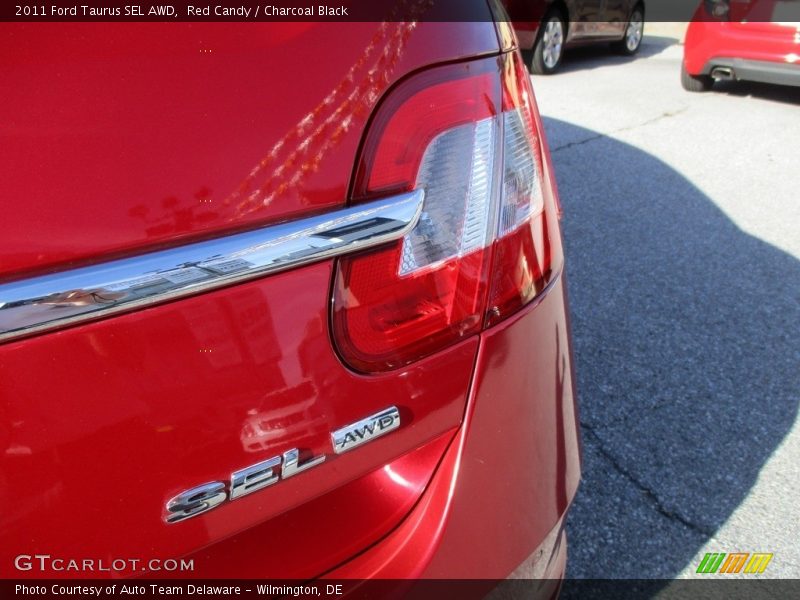 Red Candy / Charcoal Black 2011 Ford Taurus SEL AWD