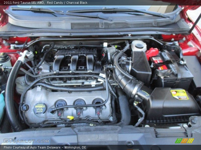 Red Candy / Charcoal Black 2011 Ford Taurus SEL AWD