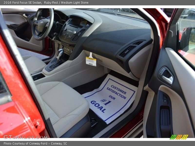 Ruby Red / Medium Light Stone 2016 Ford Focus SE Sedan