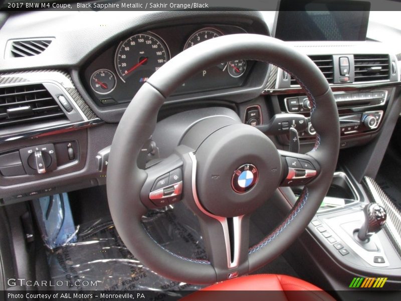 Black Sapphire Metallic / Sakhir Orange/Black 2017 BMW M4 Coupe