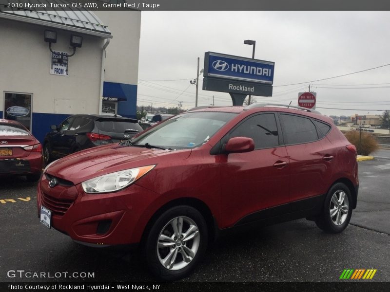 Garnet Red / Taupe 2010 Hyundai Tucson GLS AWD