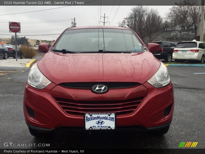 Garnet Red / Taupe 2010 Hyundai Tucson GLS AWD