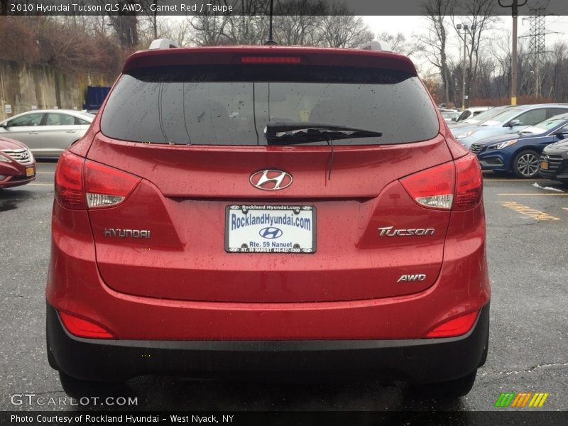 Garnet Red / Taupe 2010 Hyundai Tucson GLS AWD