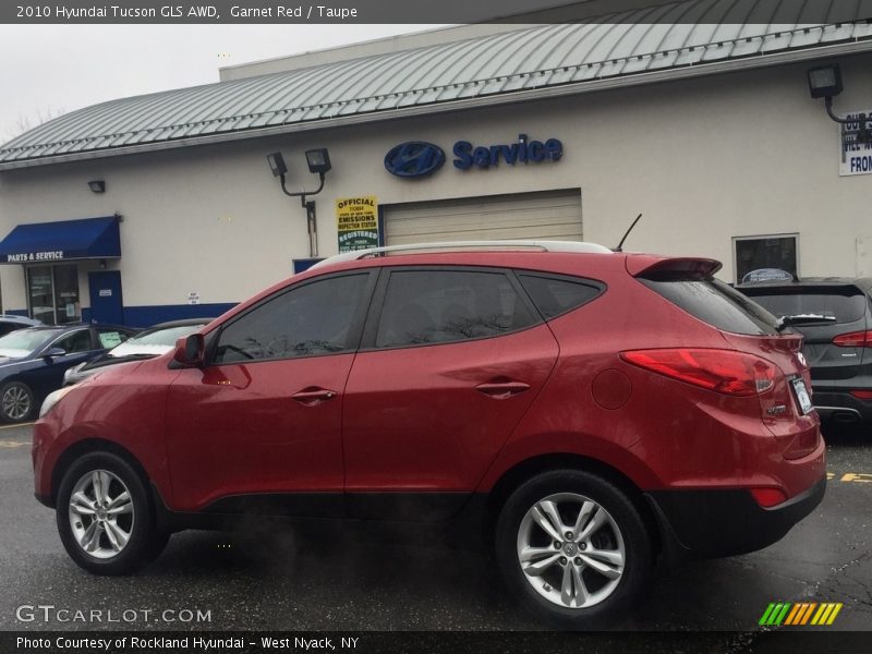 Garnet Red / Taupe 2010 Hyundai Tucson GLS AWD