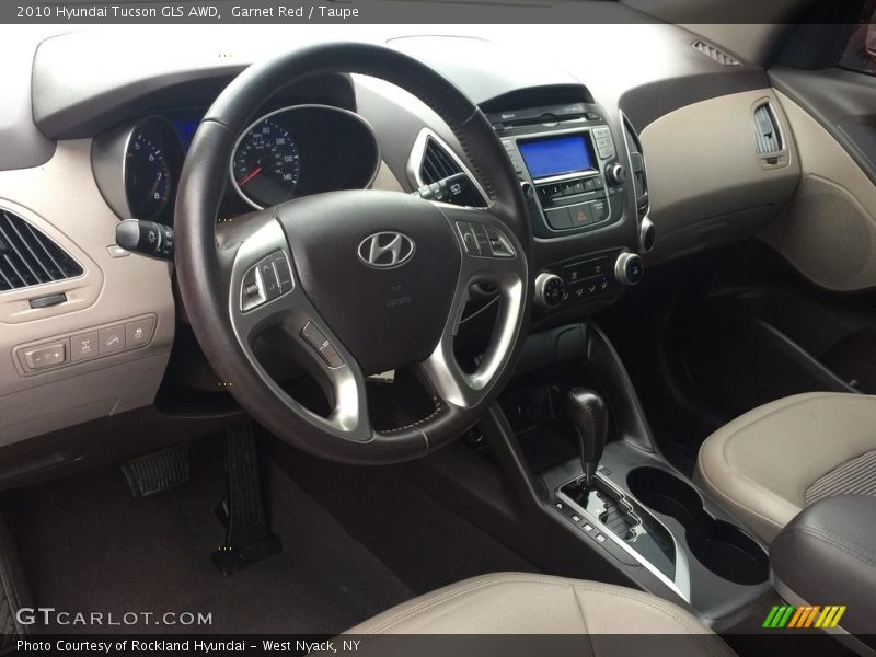 Garnet Red / Taupe 2010 Hyundai Tucson GLS AWD